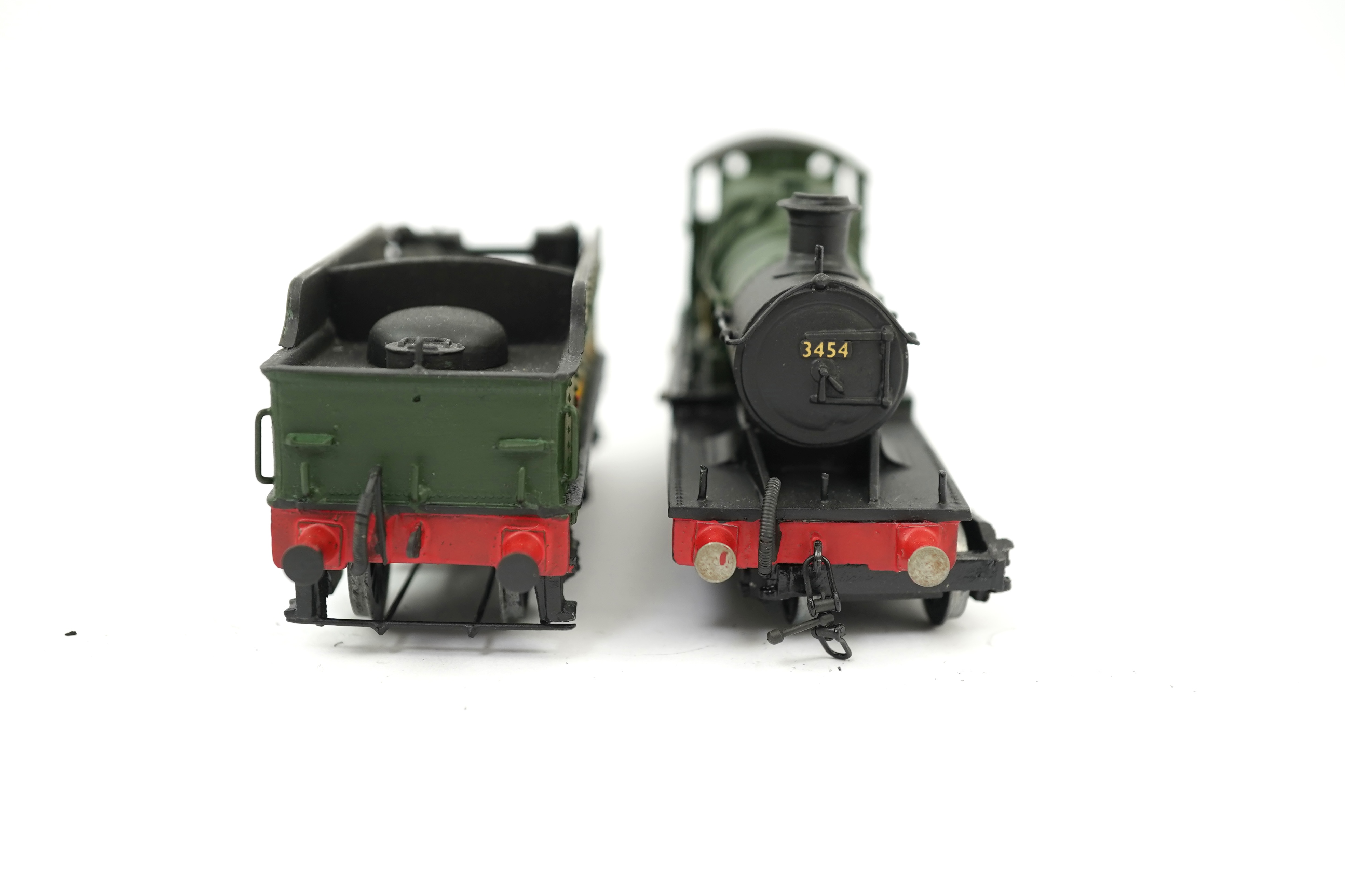 Three 00 gauge brass and white metal kit built GWR tender locomotives; a 2884 class 2-8-0, 2884, together with an 33xx class 4-4-0, 3454, and a War Dept. 2-8-0, 3012, all constructed, painted and lined to a high standard